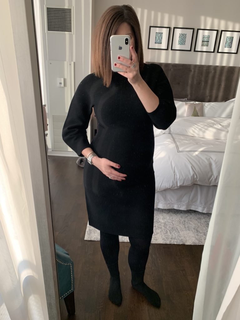 woman wearing black dress for maternity capsule wardrobe