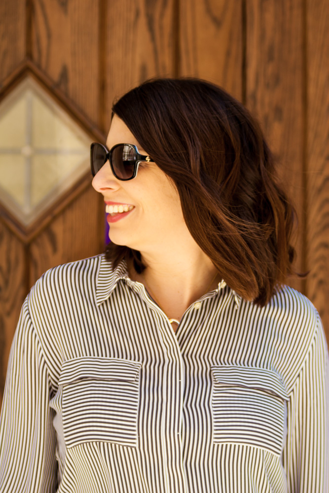 woman wearing striped utility blouse with pockets