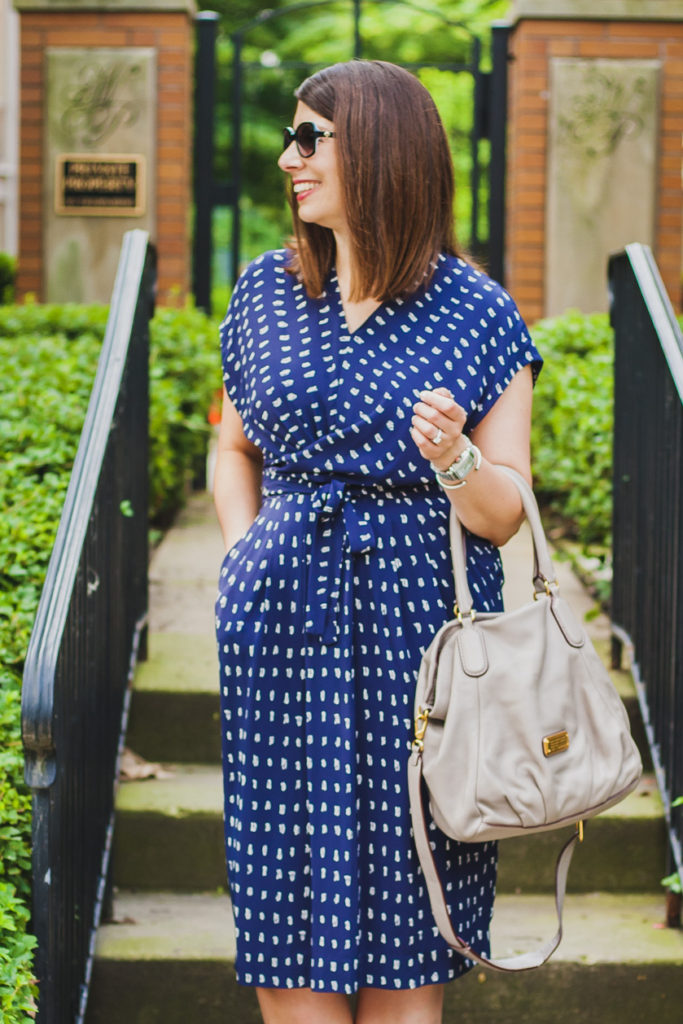 woman wearing MM Casual LaFleur Jasmin Dress and holding a bag