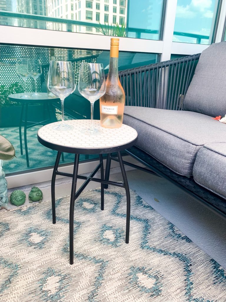 outdoor table with wine and wine glass in a patio