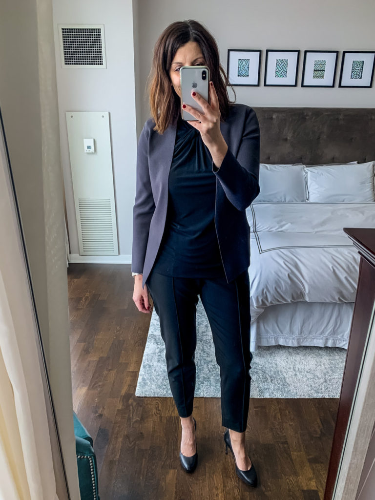 woman wearing black top and pants for office style with mm lafleur work wear