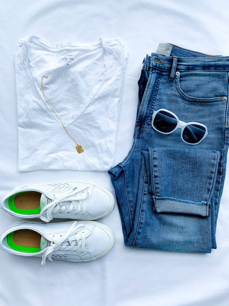 jeans, a white tee and white sneakers. 