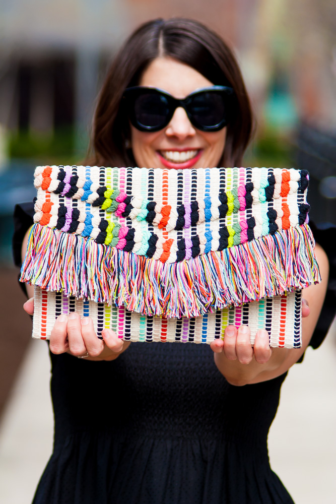 woman showing a colorful pouch 