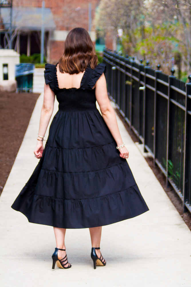 back of a woman wearing black dress for nap dress review
