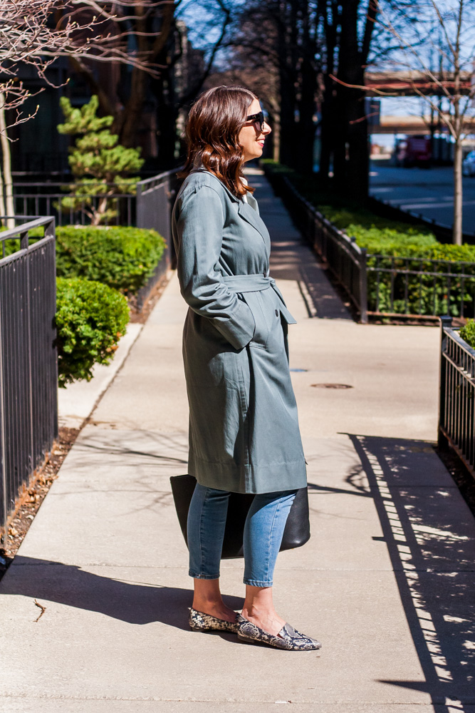 side image of a woman wearing unique trench coat