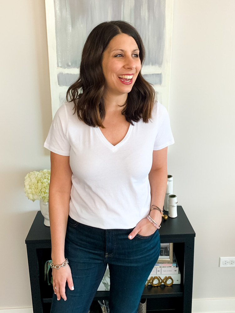 woman looking far wearing best white t shirt and jeans