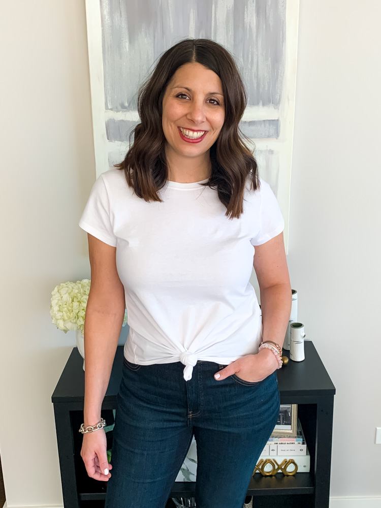 woman smiling and wearing white shirt from Abercrombie Knotted Crew Tee 