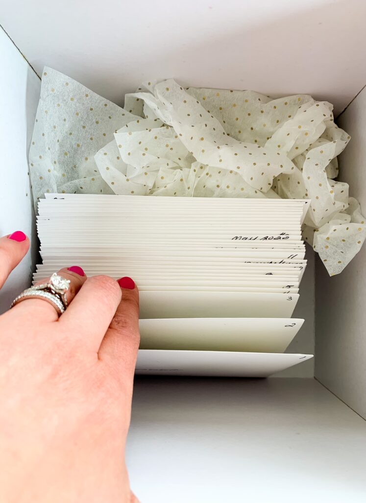 letters in envelopes inside a box