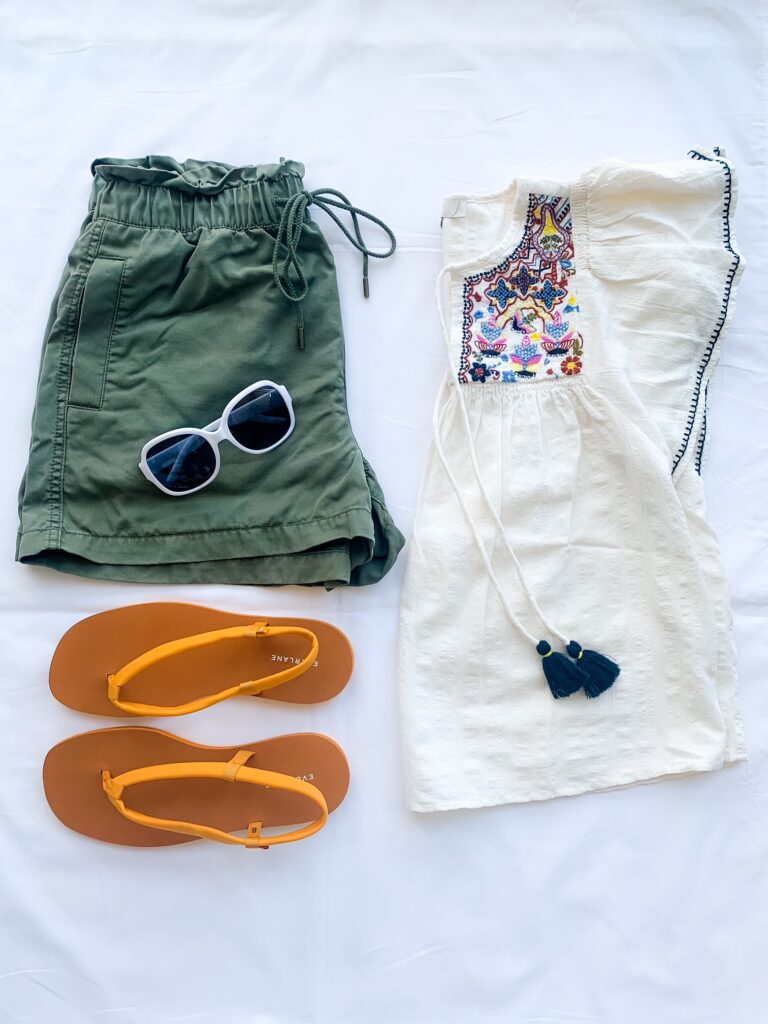 white top, slippers, and green summer shorts outfit