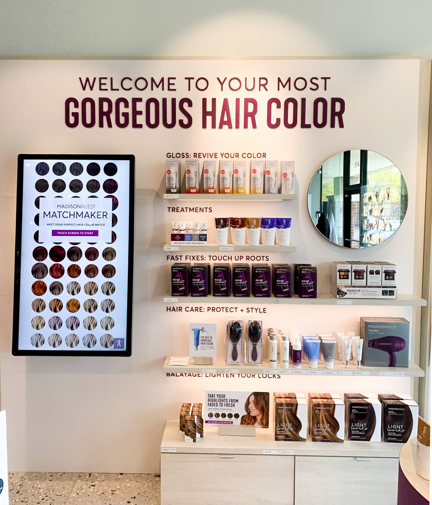 wall of hair products in Madison Reed Color Bar 