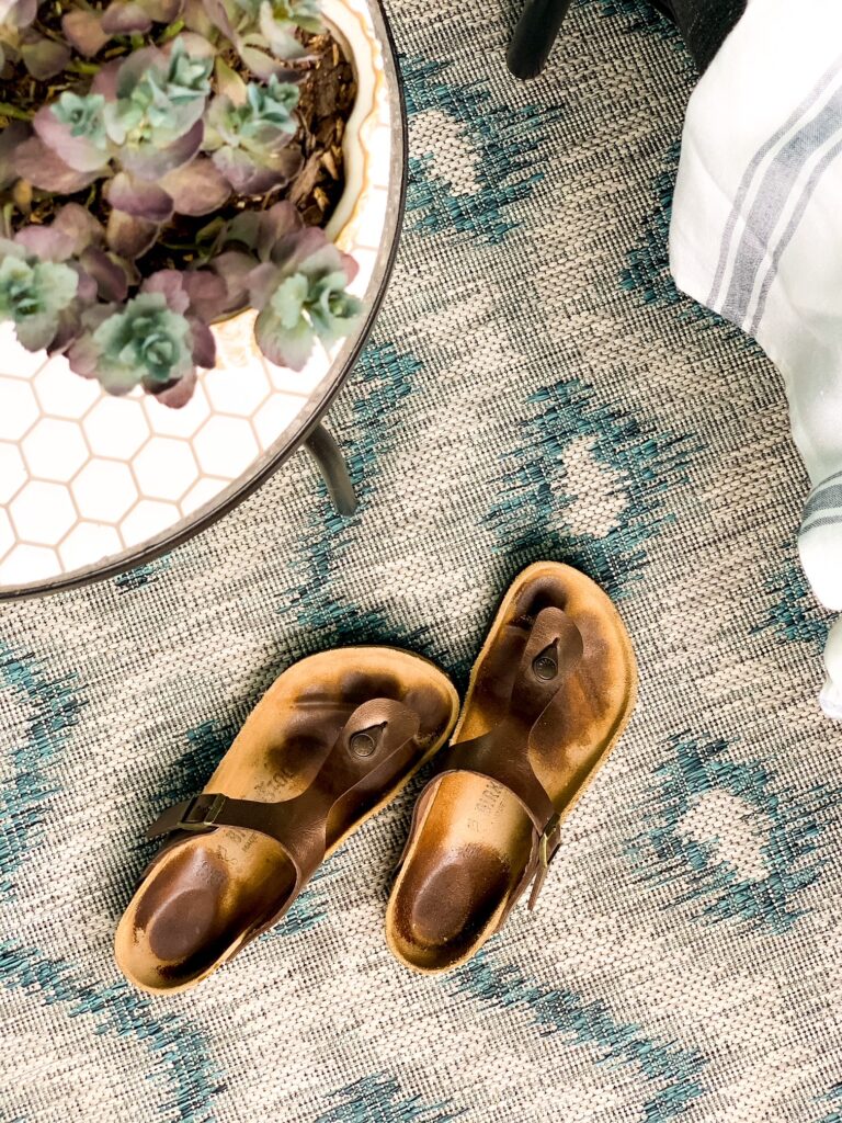 birkenstock sandals on a carpeted floor
