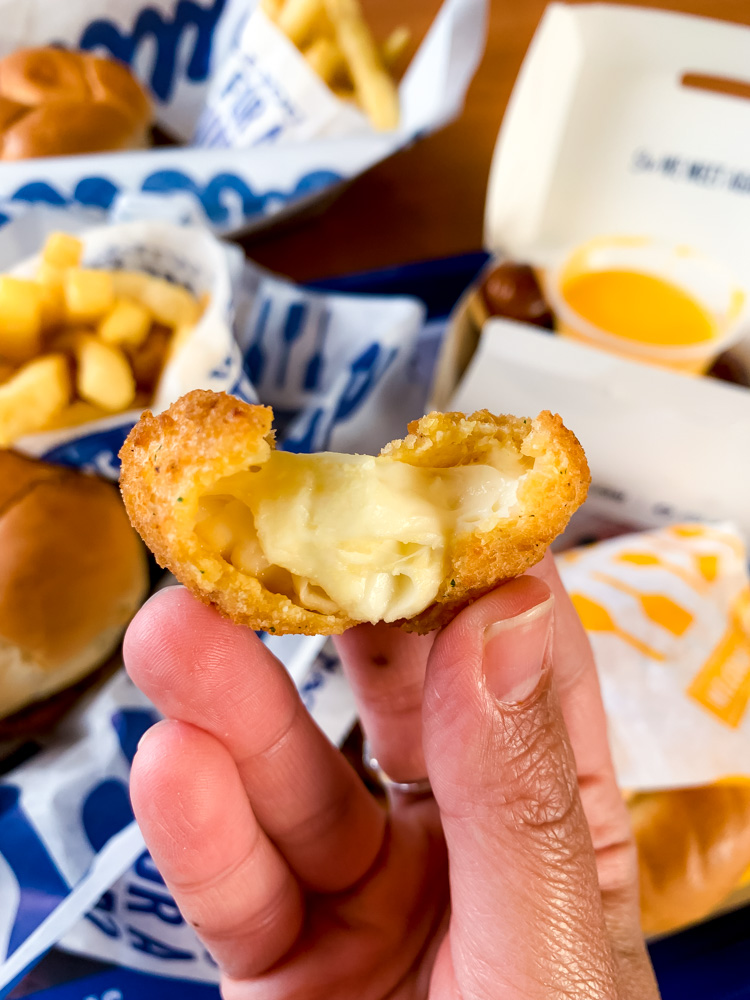 person holding Wisconsin Cheese Curds