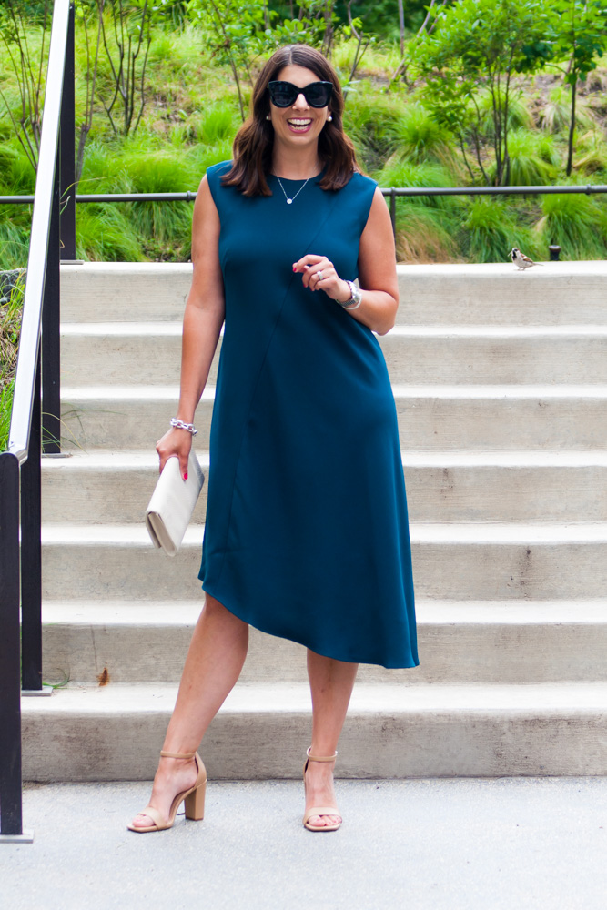 woman wearing sunglasses and asymmetrical dress for post pandemic fashion