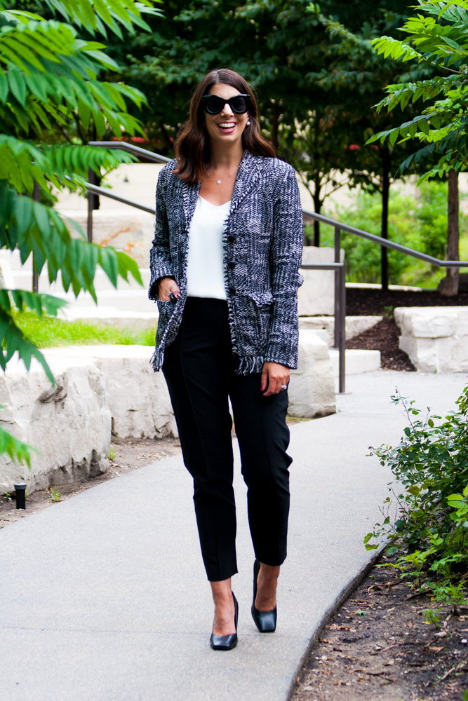 woman wearing white top, M.M.LaFleur Porter Jacket, and black pants for post pandemic fashion