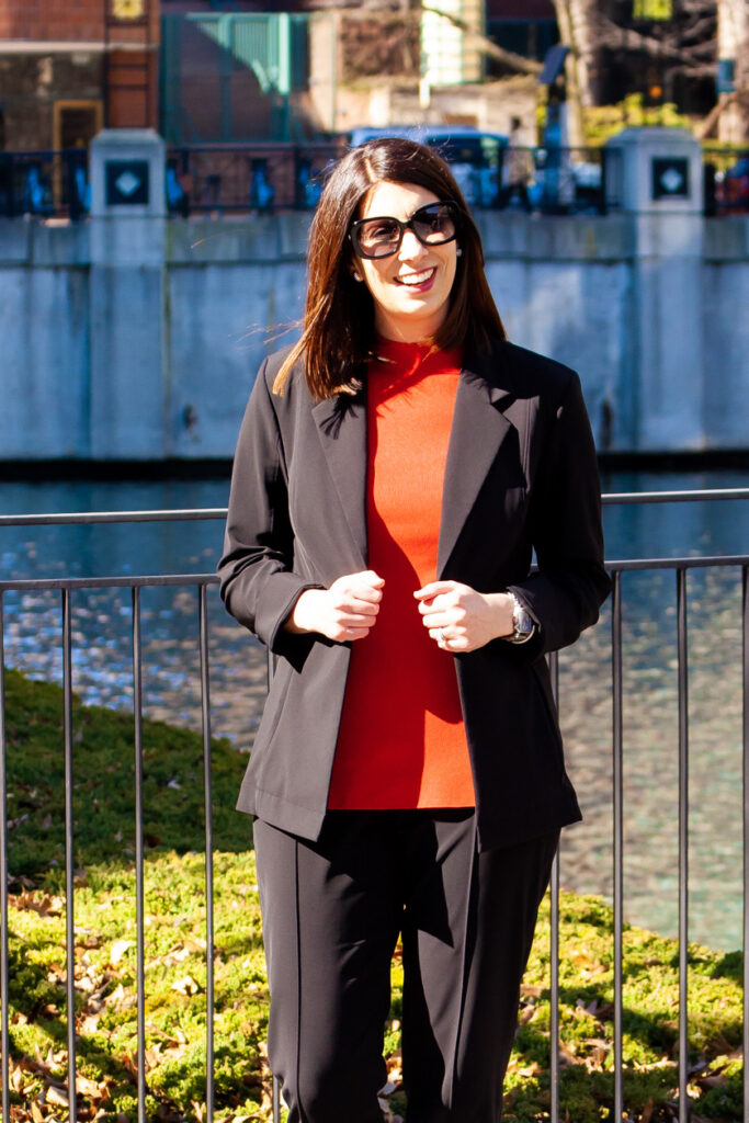 woman wearing suit and red top 