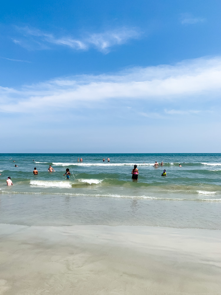 people swimming at hilton head island's coligny beach