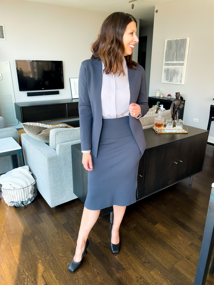 woman wearing blazer, skirt, and shirt