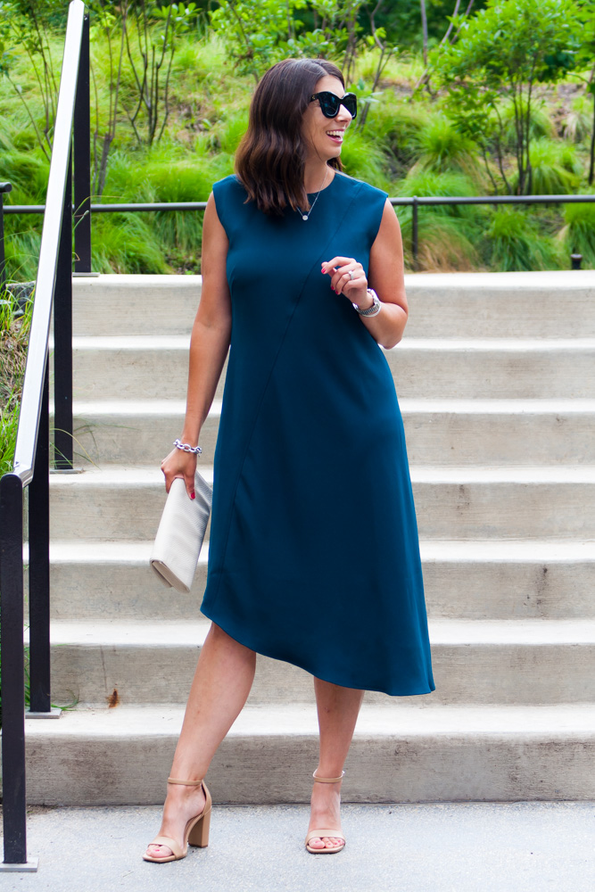 woman wearing asymmetric dress and woman explaining wedding guest dress codes