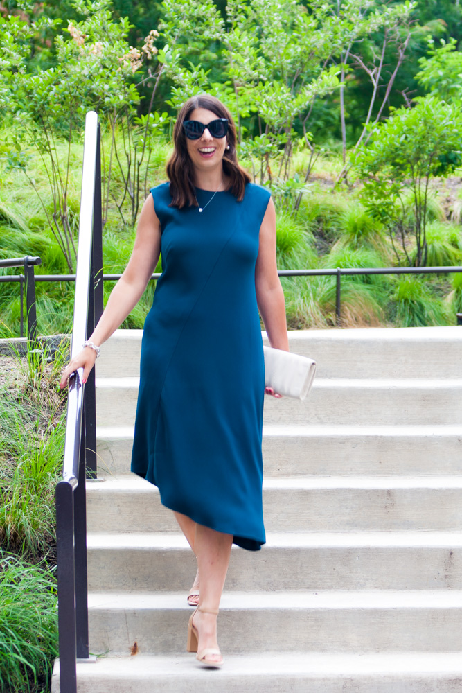 woman wearing asymmetric dress and walking down the stairs 