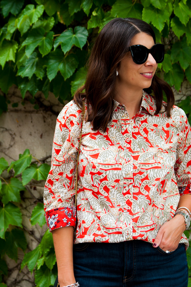 woman wearing bold pattern blouse