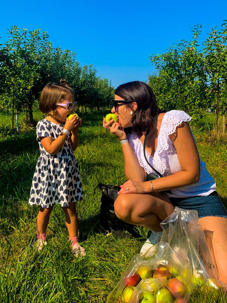 mom and daughter apple picking 