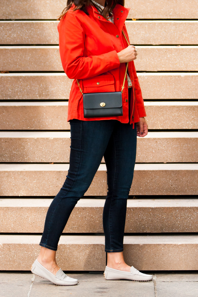 woman in red jacket and jeans 