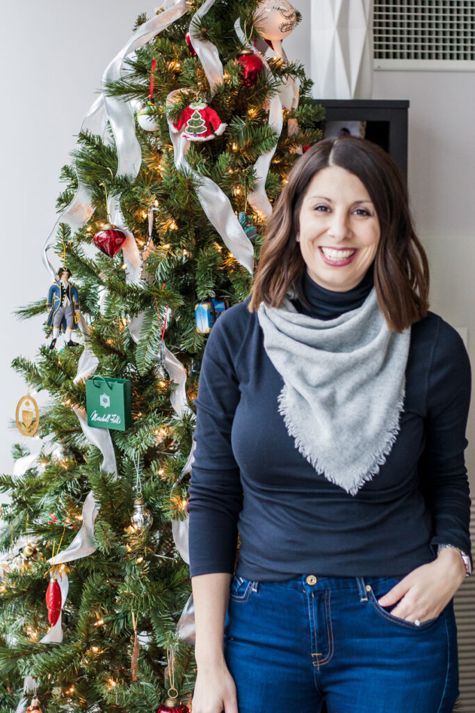 woman near the Christmas tree sharing favorite things gift guide