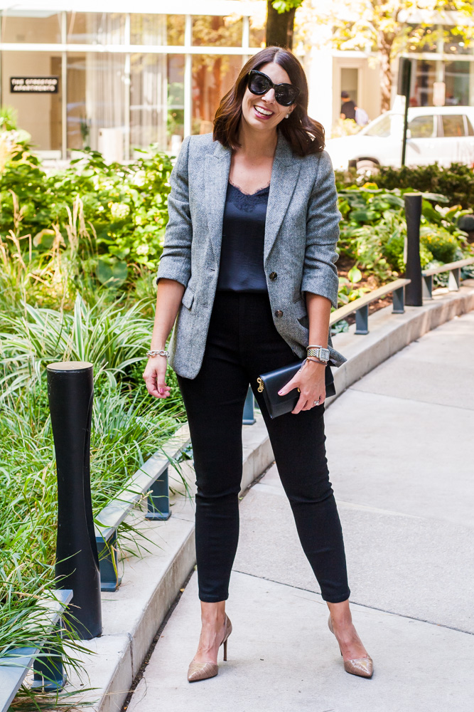 woman in satin top and black pants