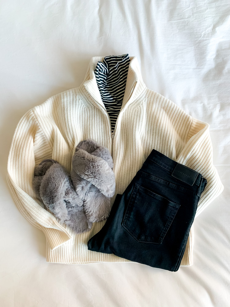 flat lay of Everlane Sweaters - The Felted Merino Half Zip Sweater, jeans, and slippers