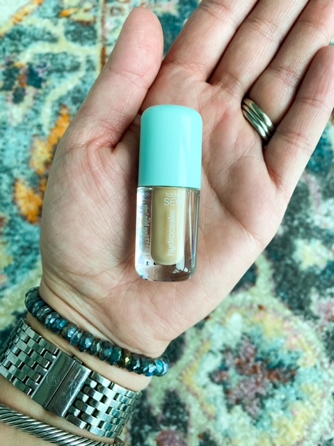 woman holding Tarte SEA Hydrocealer Concealer