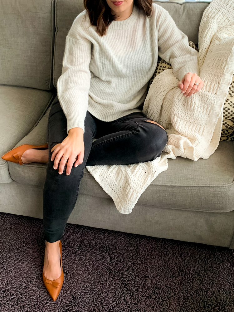 woman sitting wearing madewell maternity jeans