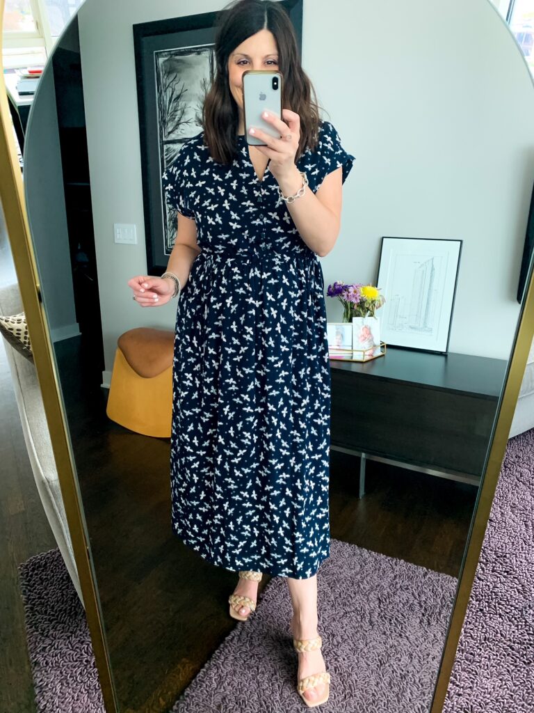 woman wearing one of her spring dresses in black and white print