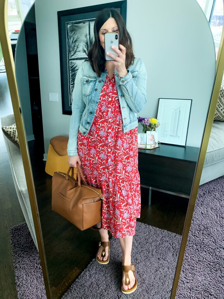 Woman wearing one of several spring dresses in red floral print