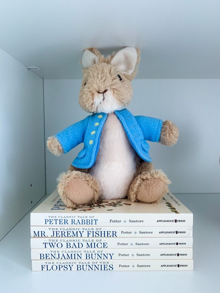 classic books and bunny stuffed toy for styling kids bookshelves 