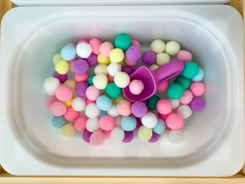 pom pom balls for a kids sensory table