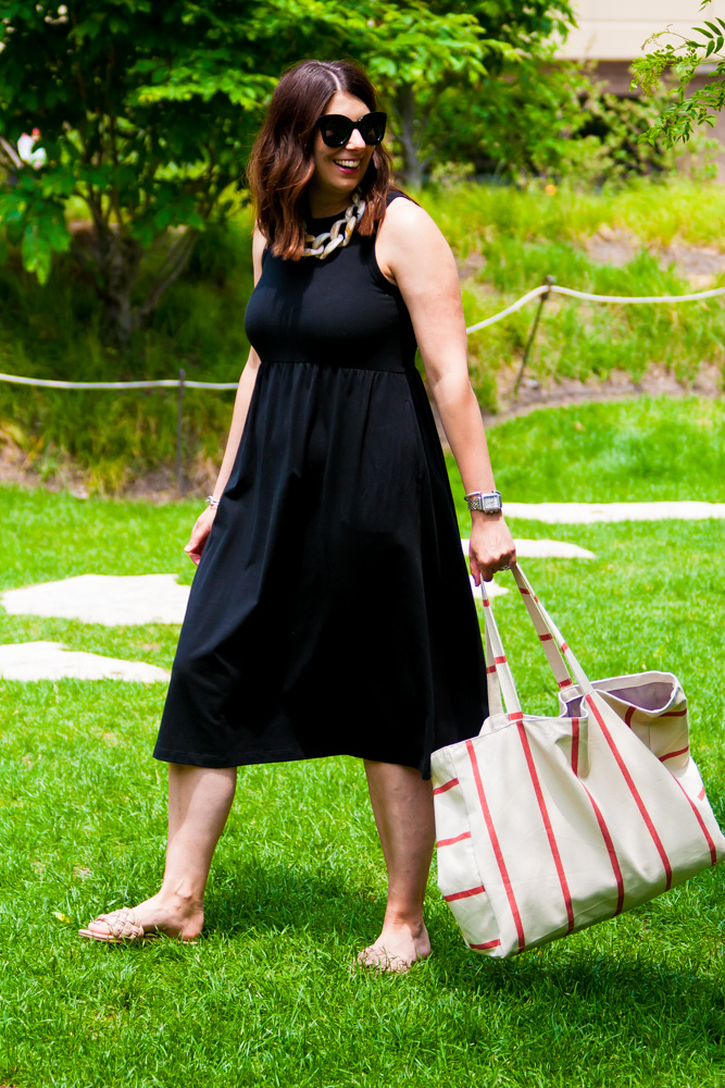 woman carrying a summer tote bag