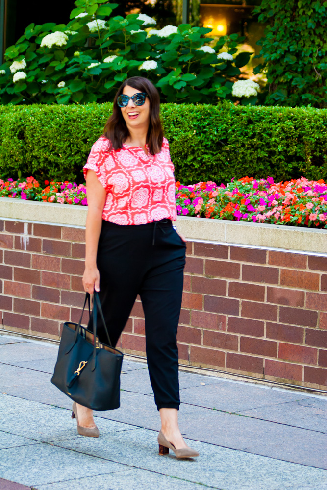 woman in one of her summer work tops and black pants