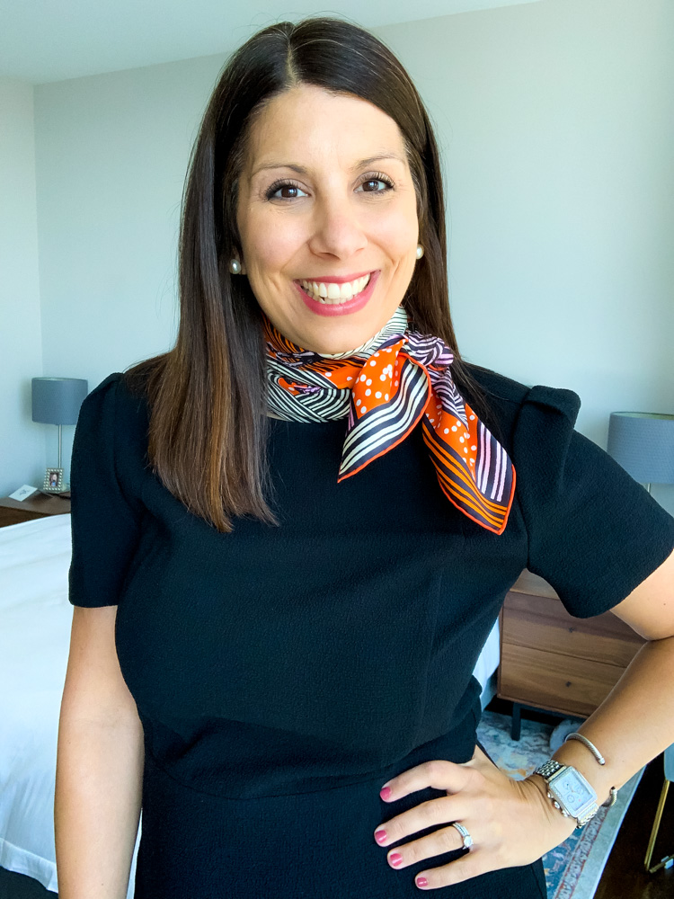 woman smiling and showing result of hermes scarf