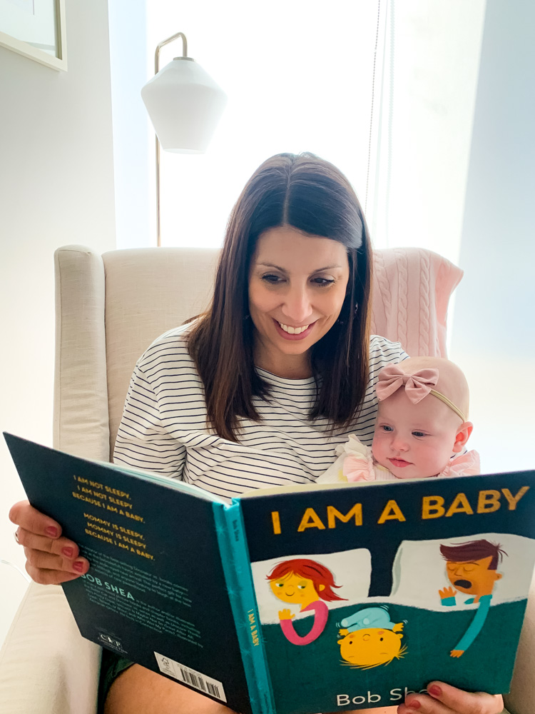 mom reading to baby