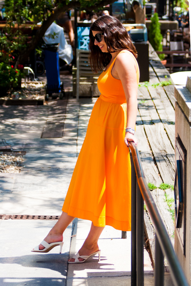 woman leaning on a  rail