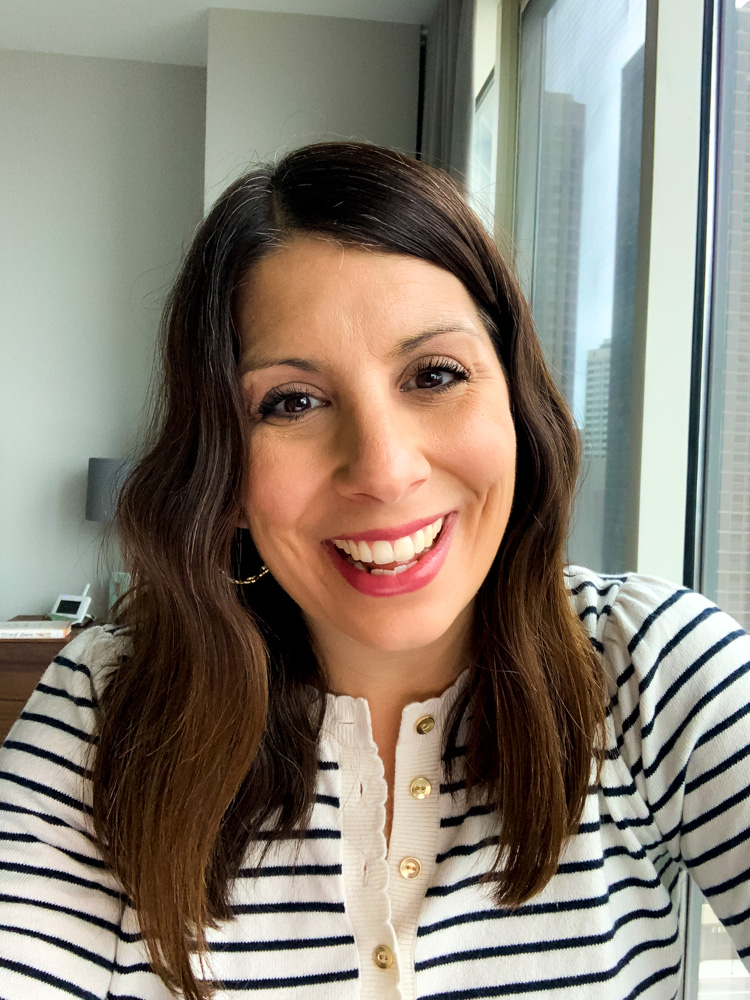 woman wearing Navy and Cream Stripe Sweater one of her tops for zoom meetings