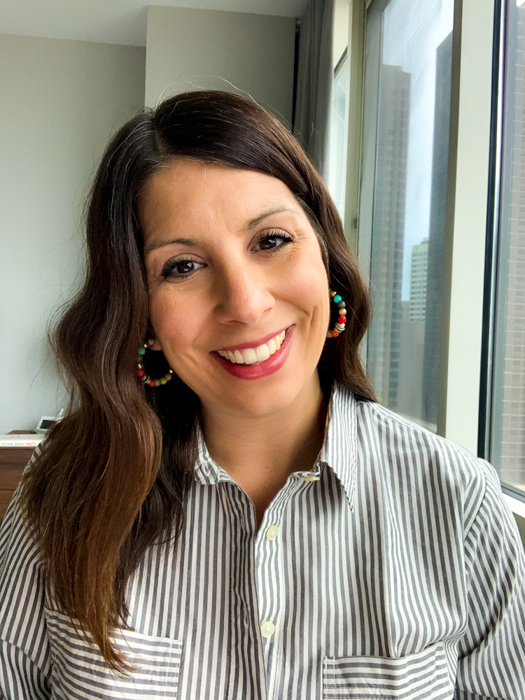 woman in Stripe Button Down one of her best tops for zoom meetings