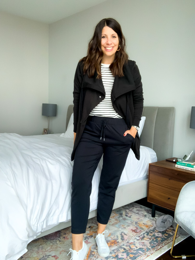woman in bedroom wearing athleisure outfit for mom