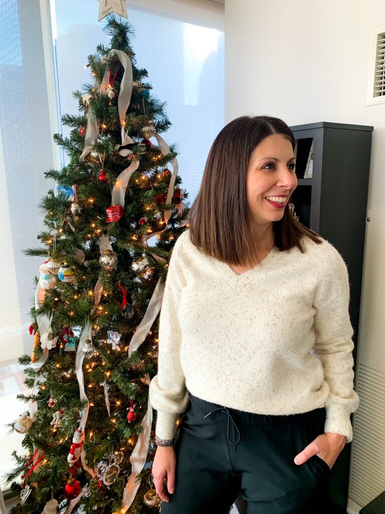 woman wearing one of her festive holiday outfits