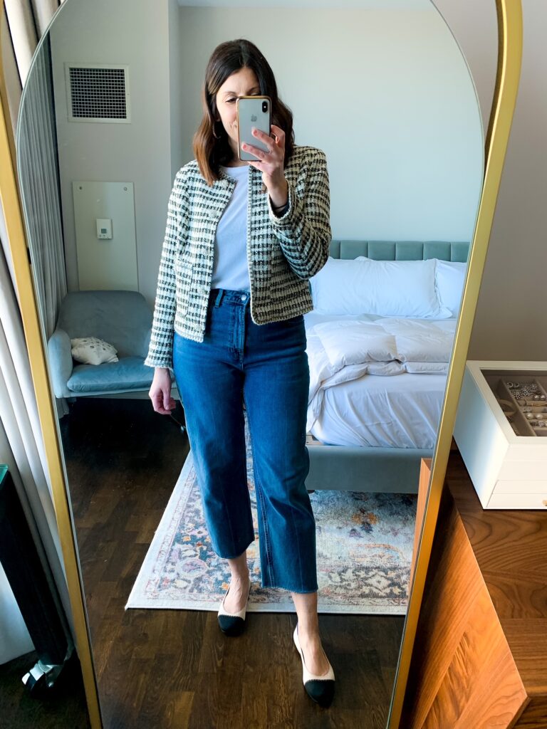 woman taking selfie of her straight leg jeans outfits with jacket