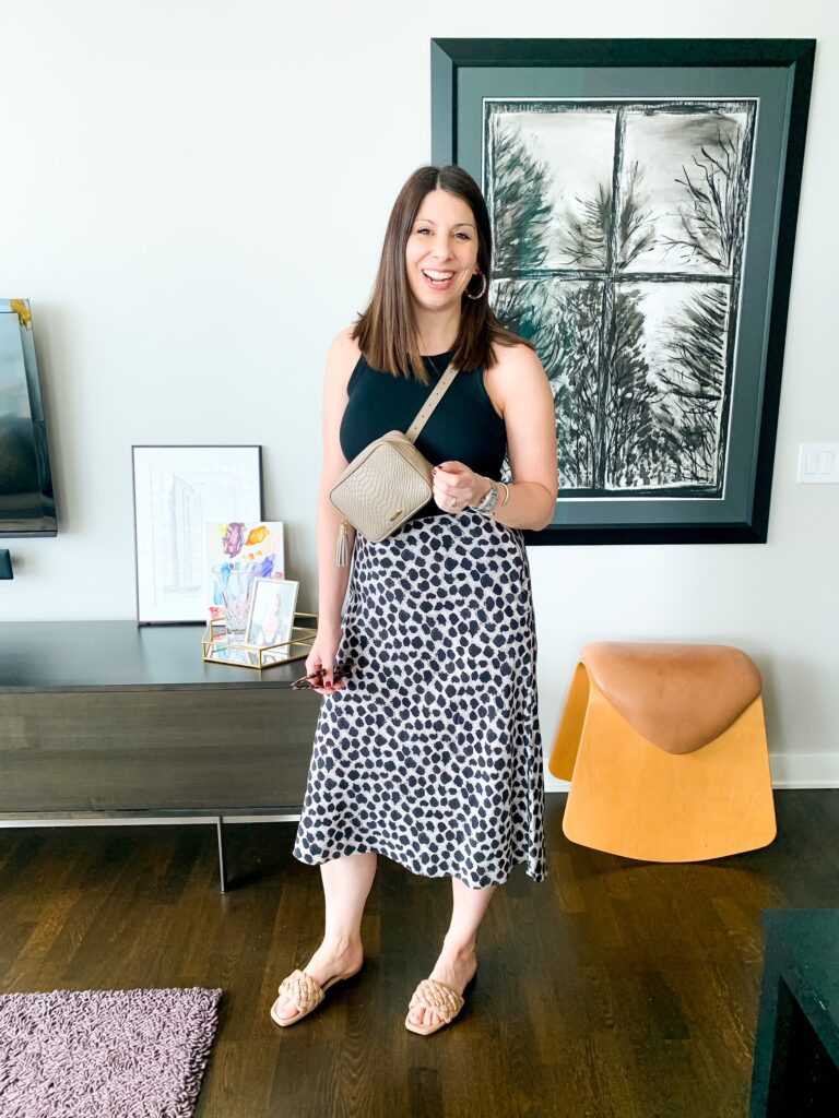 woman showing how to style a silk skirt for a casual look