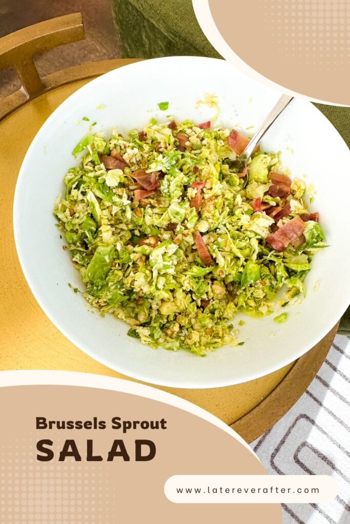Large bowl of Brussels sprout salad with pecorino Romano and toasted walnuts on a marble counter