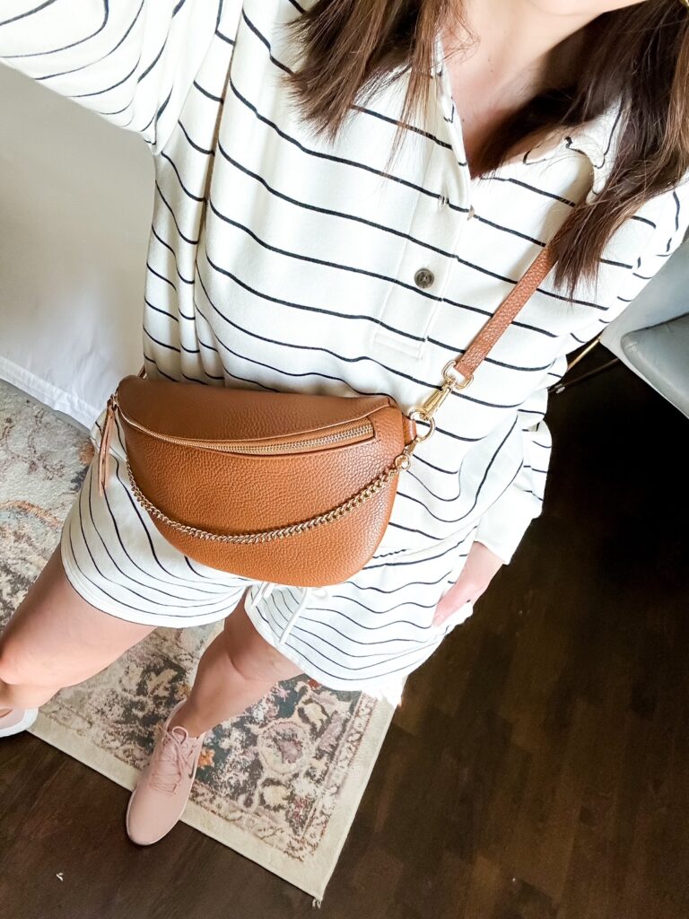 A mom in a matching short set, carrying a crossbody bag.