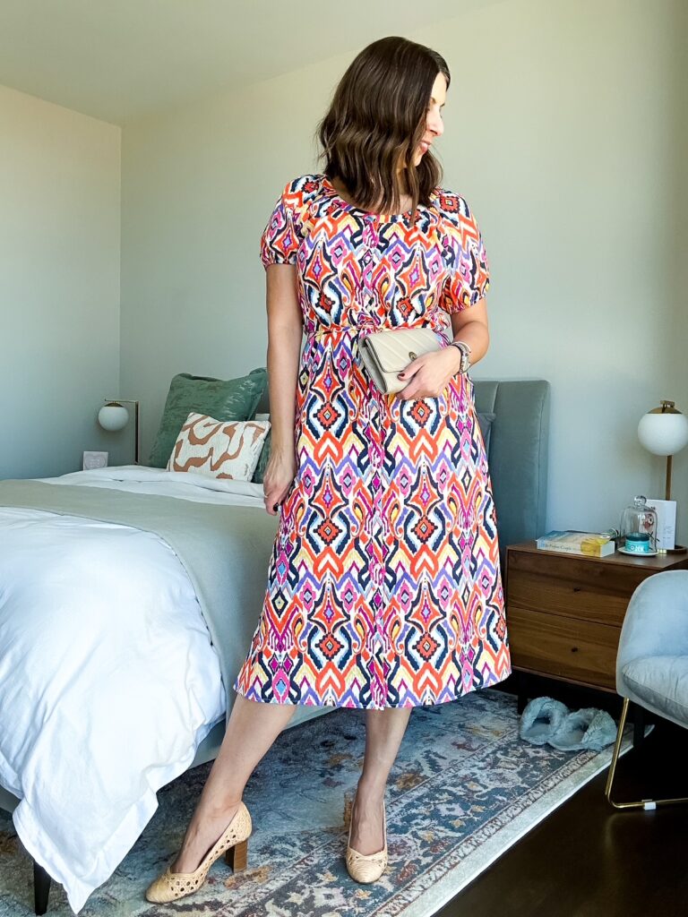 UNTUCKit Marguerite midi dress styled with rattan shoes; Close-up of flutter sleeve and cotton texture.