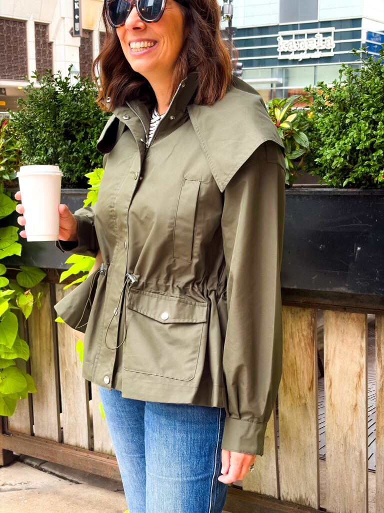 walmart funnel neck jacket, woman in the city wearing a green jacket